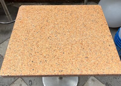 Square granite countertop fabrication installed on a restored tiled floor by Marble Lite Inc. in a NYC kitchen.