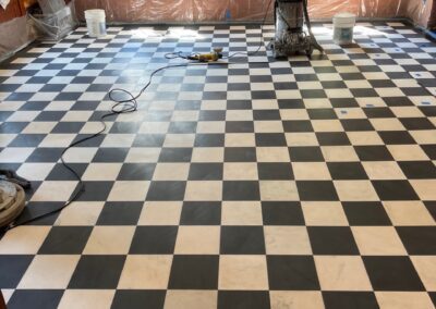 Black and white checkered floor restoration on marble/terrazzo in a large NYC commercial lobby by Marble Lite Inc.